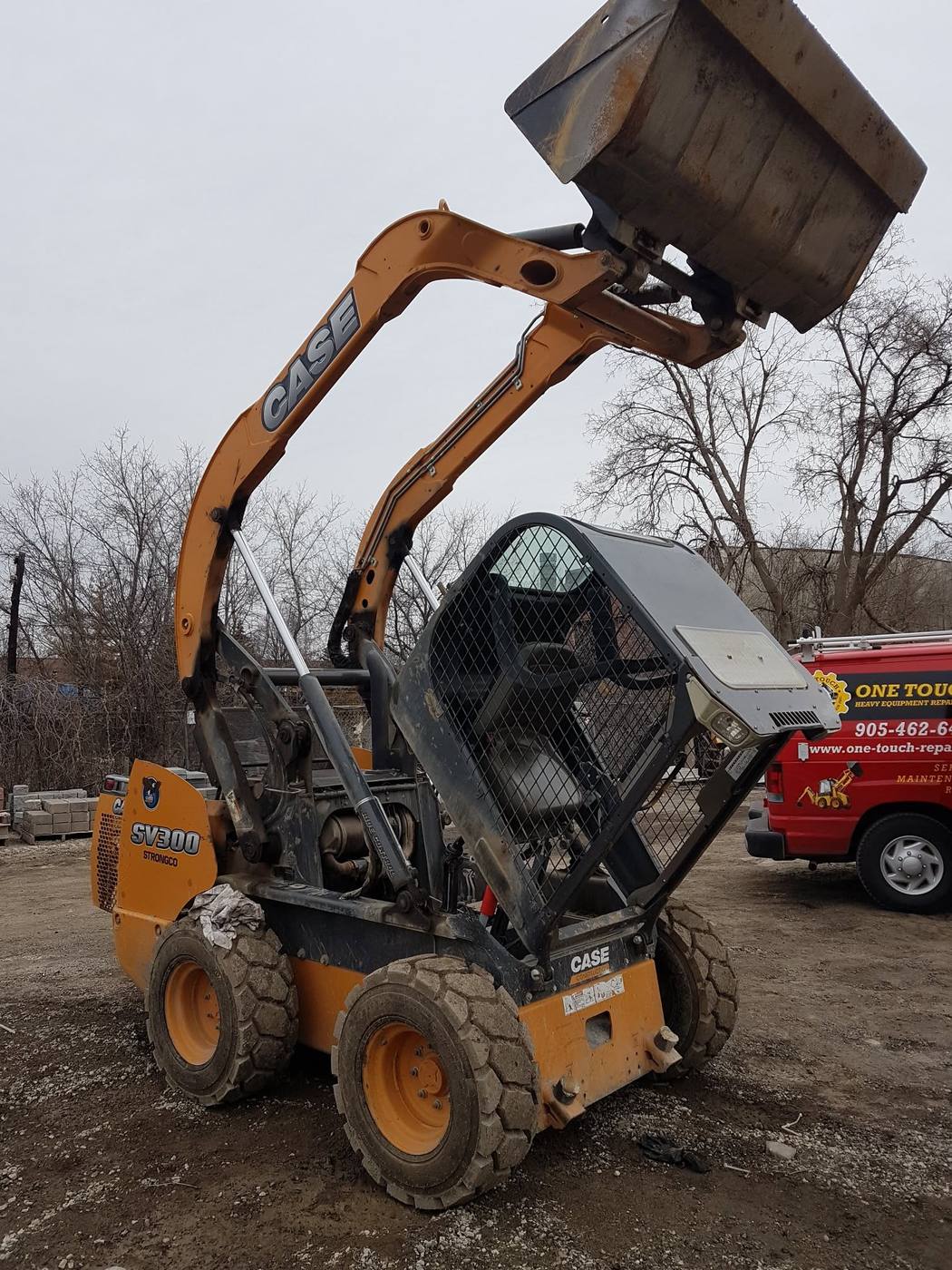 Case SV300 skid steer with cab tilted back for engine and hydraulic service, One Touch service van on site