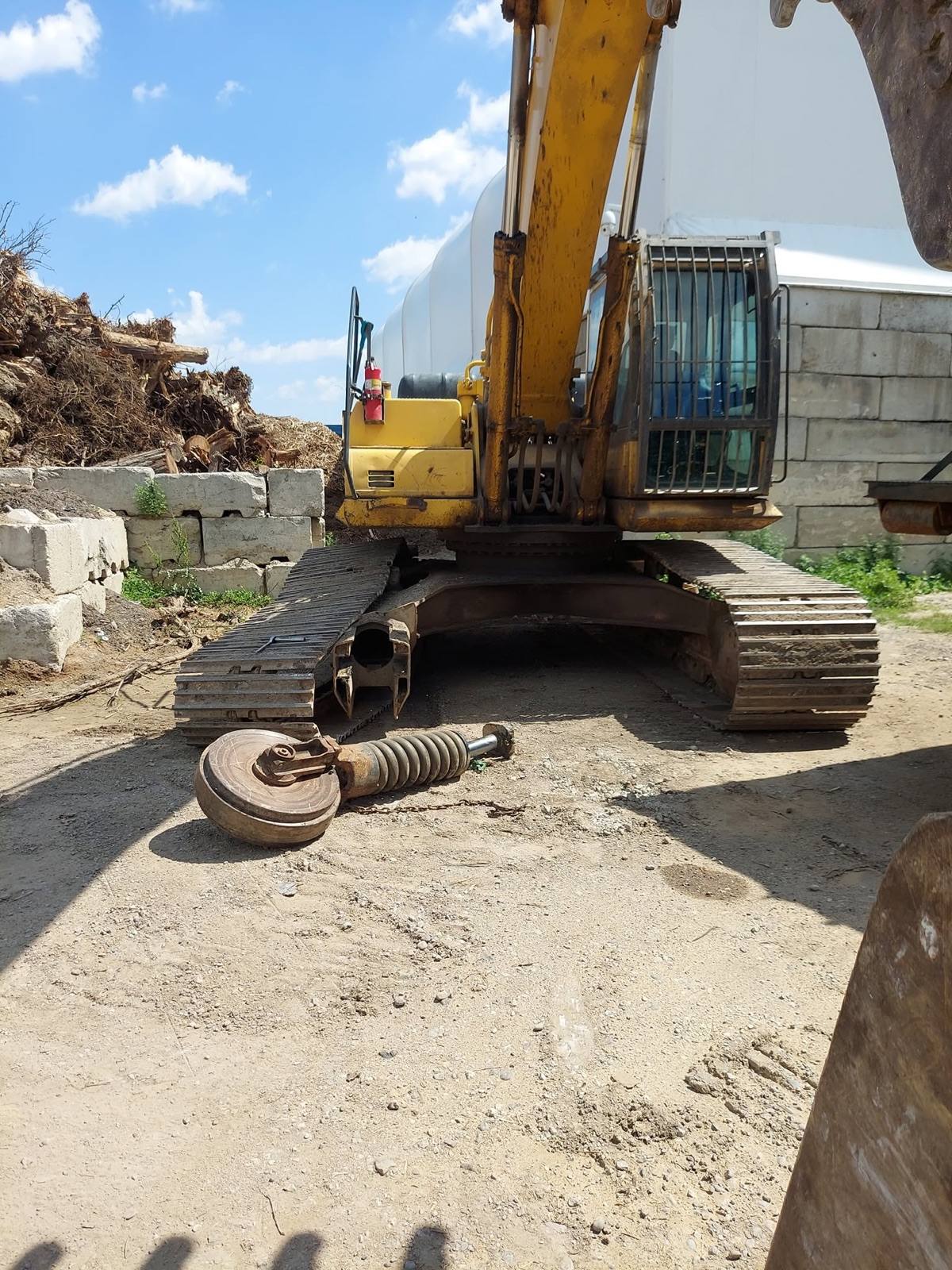 On-site excavator undercarriage and recoil spring repair by One Touch Heavy Equipment Repair